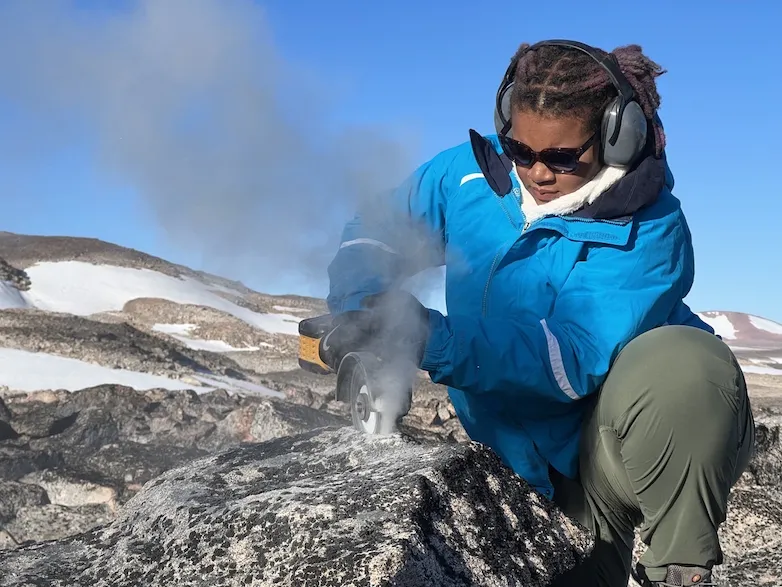 Liza Wilson collecting rock sample